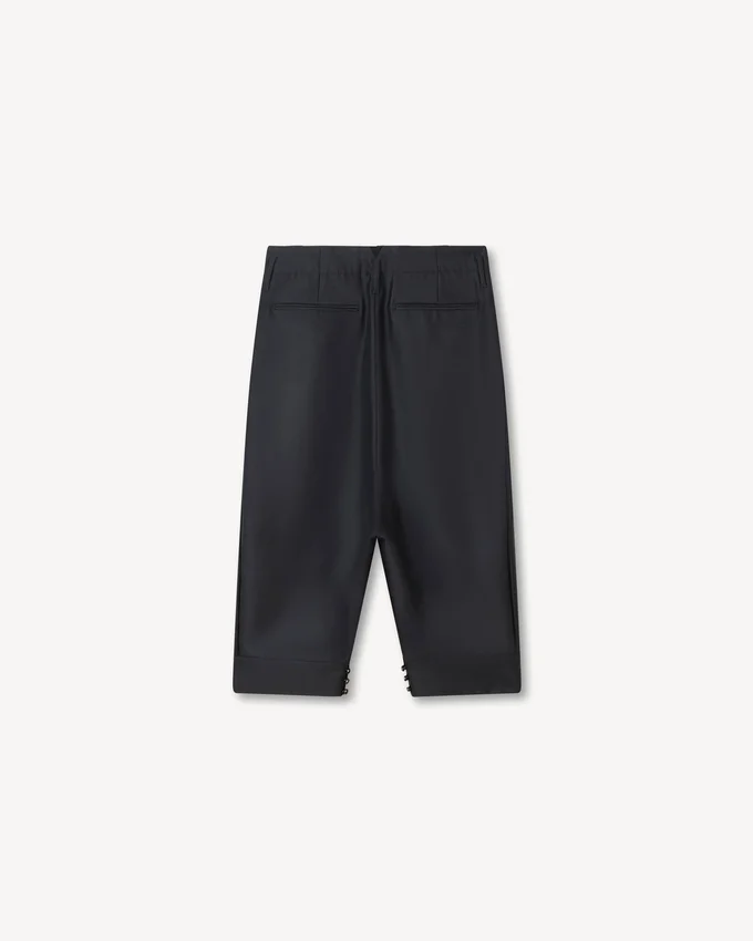 Pantaloni cropped sartoriali a pieghe in lana vergine e seta Pantaloni cropped sartoriali a pieghe in lana vergine e seta